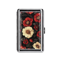A rectangular metal card case with a polished silver border, featuring a vintage floral design on the front with red and cream flowers on a black background.